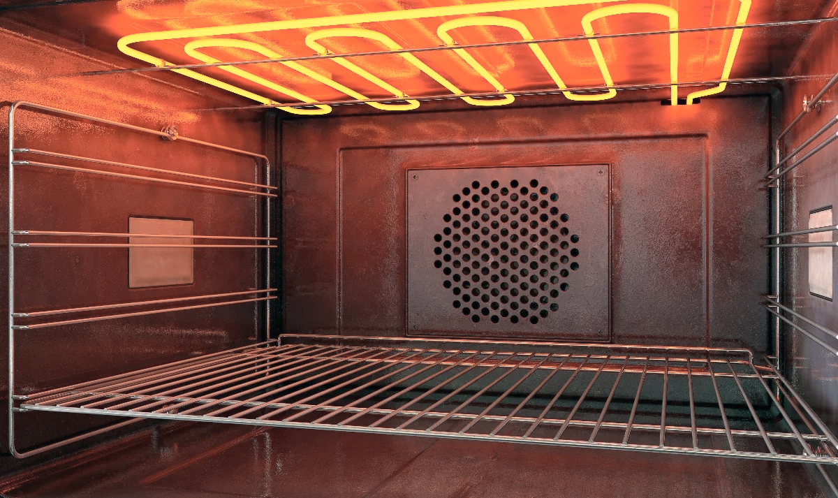 Interior view of an empty electric oven with orange glowing heating elements on the top. The oven has a dark, metallic finish with a grate shelf in the center, a fan and heat distribution plate at the back, and a temperature sensor on the top left side.